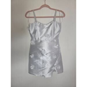 White satin mini dress with 3D white flowers by Klesis